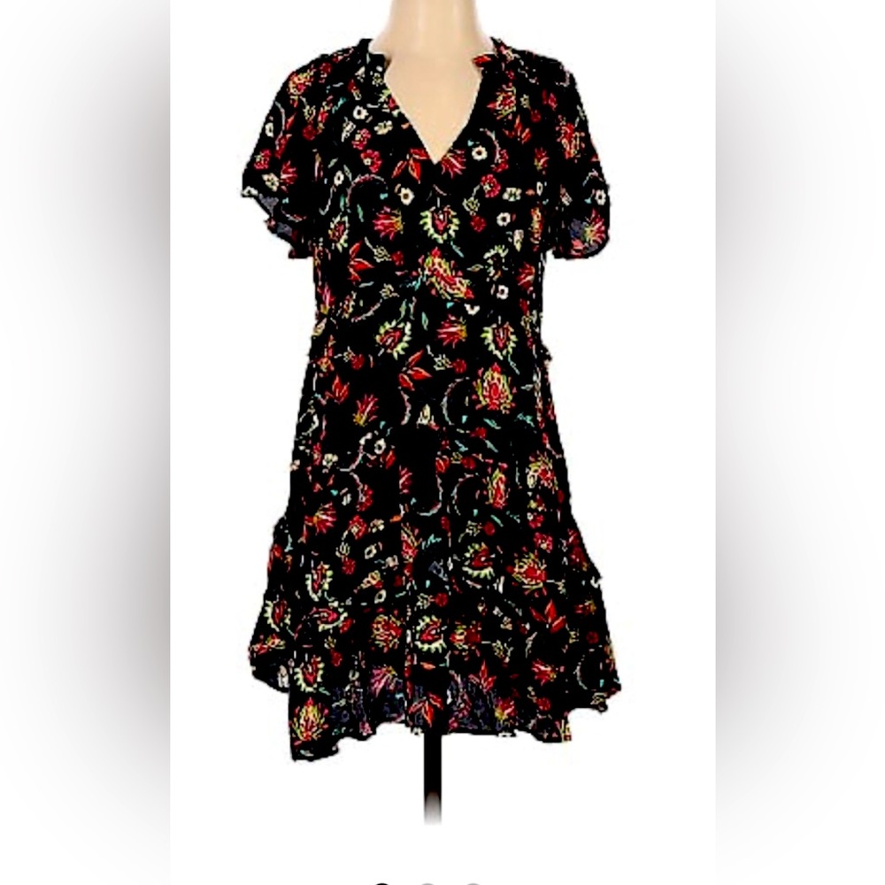 Floral print mini dress.  Relaxed fit with ruffle and frill accents. Boho chic.